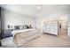 Bright bedroom with a bed, crib, grey walls, and carpet flooring at 1132 Mossy Rock Dr, Summerville, SC 29485