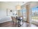 Elegant dining area with a marble-top table, stylish chairs, and a modern chandelier at 1132 Mossy Rock Dr, Summerville, SC 29485