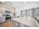Modern kitchen with stainless steel appliances, sleek countertops, and a large island with a sink at 1132 Mossy Rock Dr, Summerville, SC 29485