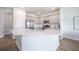 Modern kitchen with stainless steel appliances, sleek countertops, and a large island with a sink at 1132 Mossy Rock Dr, Summerville, SC 29485