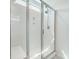 Bright shower with glass doors, shower head, and a built-in bench at 1132 Mossy Rock Dr, Summerville, SC 29485