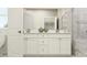 Elegant bathroom with a double vanity, sleek fixtures, and a tiled shower at 1151 Darling St, Summerville, SC 29485
