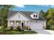 Charming single-Gathering home with a two-car garage, a cozy front porch, and well-maintained landscaping at 1151 Darling St, Summerville, SC 29485