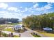 Stunning aerial view of community entrance, showcasing landscaping, water feature and welcome center at 1159 Darling St, Summerville, SC 29485