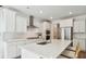 Modern kitchen with stainless steel appliances, quartz countertops, and a center island with seating at 1159 Darling St, Summerville, SC 29485