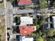 An aerial view of a charming neighborhood showcases beautiful rooftops and tree-lined streets at 125 Ashley Ave, Charleston, SC 29401