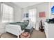 Cozy bedroom featuring bright natural light, comfortable furnishings, and inviting decor at 125 Ashley Ave, Charleston, SC 29401
