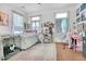 Bedroom featuring wood floors, a cozy bed, desk, storage shelves and natural lighting at 125 Ashley Ave, Charleston, SC 29401