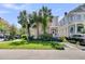Charming two-story home with a quaint front porch, lush landscaping, and available parking at 125 Ashley Ave, Charleston, SC 29401