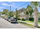 Charming two-story house with a balcony, lush landscaping, and street parking at 125 Ashley Ave, Charleston, SC 29401