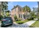 Charming two-story home with a quaint front porch, parking and lush landscaping at 125 Ashley Ave, Charleston, SC 29401