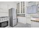Bright kitchen with stainless steel appliances, built in cabinetry, and natural light at 125 Ashley Ave, Charleston, SC 29401