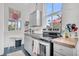 Bright kitchen with butcher block countertops, stainless steel appliances, and a window with views at 125 Ashley Ave, Charleston, SC 29401