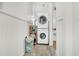 Convenient laundry area with stacked washer and dryer units, and plenty of storage space at 125 Ashley Ave, Charleston, SC 29401