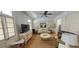 Bright living room featuring wood floors, a large TV, and comfortable seating at 125 Ashley Ave, Charleston, SC 29401