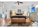 Bright main bedroom with a ceiling fan, hard wood flooring, and modern decor at 125 Ashley Ave, Charleston, SC 29401