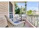 Inviting front porch with wicker furniture and views of lush greenery at 125 Ashley Ave, Charleston, SC 29401