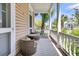 Charming covered porch with wicker seating and a view of the neighborhood at 125 Ashley Ave, Charleston, SC 29401