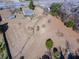Aerial view of a single Gathering home and lot with mature trees and a large yard close to the road at 126 N Hwy 52, Moncks Corner, SC 29461