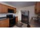 Cozy kitchen layout with modern appliances, wood cabinets, and plenty of natural light at 126 N Hwy 52, Moncks Corner, SC 29461