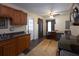 Well-equipped kitchen with wooden cabinets, ceiling fan, and a view into the dining area at 126 N Hwy 52, Moncks Corner, SC 29461