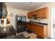 Functional kitchen features wood cabinetry, stainless steel appliances, and a nearby doorway for easy access at 126 N Hwy 52, Moncks Corner, SC 29461
