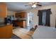 Well-lit kitchen features wooden cabinets, stainless steel appliances, and an adjacent door to outdoor area at 126 N Hwy 52, Moncks Corner, SC 29461