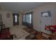 Inviting living room featuring large windows, tile flooring, and cozy seating arrangements at 126 N Hwy 52, Moncks Corner, SC 29461