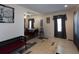 Inviting living room and dining area with neutral walls, dark wood bench, and charming window curtains at 126 N Hwy 52, Moncks Corner, SC 29461