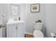 Bathroom with a white vanity, a toilet, light gray walls and wood-look floors at 1309 Berry Grove Dr, Summerville, SC 29485