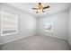 Bedroom with carpet, ceiling fan, neutral paint, and two large windows at 1309 Berry Grove Dr, Summerville, SC 29485