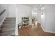 Hallway with carpeted stairs and a plant stand leading to dining room at 1309 Berry Grove Dr, Summerville, SC 29485