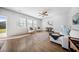 Living room features hardwood floors, neutral decor, and lots of windows at 1309 Berry Grove Dr, Summerville, SC 29485