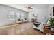 Open-concept living area with hardwood floors, large windows, and stylish furnishings at 1309 Berry Grove Dr, Summerville, SC 29485