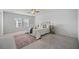 Light-filled main bedroom with carpet, large windows, and a decorative rug at 1309 Berry Grove Dr, Summerville, SC 29485