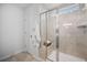 Shower with glass door, tiled walls, a built-in seat, and tiled floors at 1309 Berry Grove Dr, Summerville, SC 29485