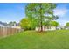 Expansive backyard featuring a well-maintained lawn and tall trees for a private outdoor space at 1312 Belle Grove Cir, Hanahan, SC 29410