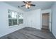This bedroom features a ceiling fan, natural light, closet and gray flooring at 1312 Belle Grove Cir, Hanahan, SC 29410