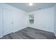 A cozy bedroom with modern vinyl flooring, a window letting in natural light and white walls at 1312 Belle Grove Cir, Hanahan, SC 29410