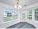 Bright dining area with bay windows offering serene backyard views at 1312 Belle Grove Cir, Hanahan, SC 29410