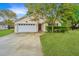 Inviting home with a well-manicured lawn and a two-car garage at 1312 Belle Grove Cir, Hanahan, SC 29410