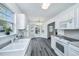 Spacious kitchen with updated countertops and eat-in area by large windows at 1312 Belle Grove Cir, Hanahan, SC 29410
