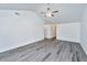 Spacious living room with vaulted ceiling, ceiling fan, gray flooring, and access to other rooms at 1312 Belle Grove Cir, Hanahan, SC 29410
