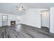 Inviting living room features a fireplace, neutral walls, gray flooring, and a glass-paneled exterior door at 1312 Belle Grove Cir, Hanahan, SC 29410