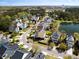 Great aerial of homes in this neighborhood near the water and featuring mature landscaping and tranquil pond views at 138 Sandshell Dr, Charleston, SC 29492