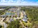 Lovely aerial view of homes near the water with tranquil pond views and lush landscaping around the neighborhood at 138 Sandshell Dr, Charleston, SC 29492