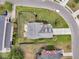 Bird's eye view of the home showcases the roof, fenced yard, surrounding landscaping, and concrete driveway at 138 Sandshell Dr, Charleston, SC 29492