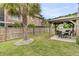 Spacious backyard featuring a gazebo with dining set and a well-maintained grassy area at 138 Sandshell Dr, Charleston, SC 29492