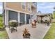 Outdoor kitchen in a backyard featuring a grill, gazebo with dining set, and an outdoor fire pit at 138 Sandshell Dr, Charleston, SC 29492