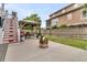 Landscaped backyard with a cozy gazebo and fire pit, ideal for outdoor relaxation and entertaining at 138 Sandshell Dr, Charleston, SC 29492